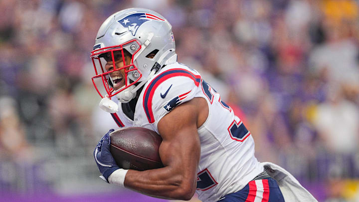 New England Patriots running back TreVeyon Henderson (32) celebrates his touchdown against the Minnesota Vikings in the first quarter at U.S. Bank Stadium. 