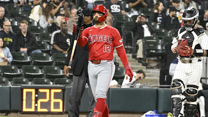 Sep 25, 2024; Chicago, Illinois, USA;  Los Angeles Angels outfielder Kevin Pillar (12) flips his bat after being called out on strikes during the fifth inning against the Chicago White Sox at Guaranteed Rate Field. 