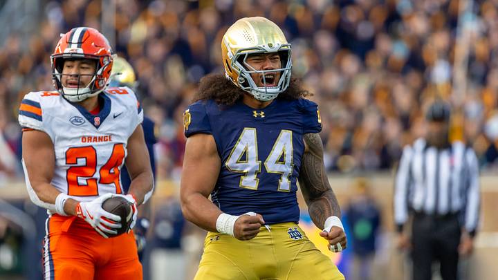 Nov 22, 2025; South Bend, Indiana, USA; Notre Dame Fighting Irish defensive lineman Junior Tuihalamaka (44) celebrates a stop against the Syracuse Orange during the first half at Notre Dame Stadium. Mandatory Credit: Michael Caterina-Imagn Images Nov 22, 2025; South Bend, Indiana, USA; Notre Dame Fighting Irish defensive lineman Junior Tuihalamaka (44) celebrates a stop against the Syracuse Orange during the first half at Notre Dame Stadium. Mandatory Credit: Michael Caterina-Imagn Images