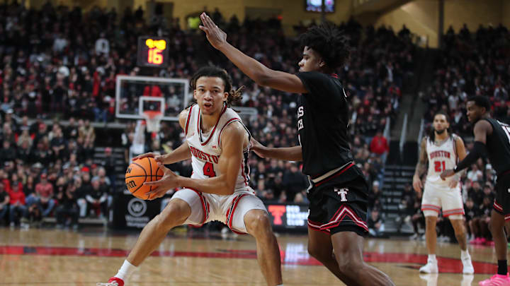 Jan 24, 2026; Lubbock, Texas, USA;  Houston Cougars guard Kingston Flemings (4) keeps the ball from Texas Tech Red Raiders guard Christian Anderson (4) in the second half at United Supermarkets Arena. 