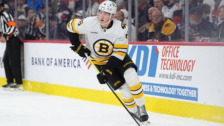 Apr 5, 2026; Philadelphia, Pennsylvania, USA; Boston Bruins defenseman Mason Lohrei (6) controls the puck against the Philadelphia Flyers in the first period at Xfinity Mobile Arena. Mandatory Credit: Kyle Ross-Imagn Images