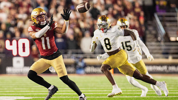 Nov 1, 2025; Chestnut Hill, Massachusetts, USA; Boston College Eagles wide receiver Lewis Bond (11) catches a pass against Notre Dame Fighting Irish safety Adon Shuler (8) in the fourth quarter at Alumni Stadium. Mandatory Credit: Edward Finan-Imagn Images Nov 1, 2025; Chestnut Hill, Massachusetts, USA; Boston College Eagles wide receiver Lewis Bond (11) catches a pass against Notre Dame Fighting Irish safety Adon Shuler (8) in the fourth quarter at Alumni Stadium. Mandatory Credit: Edward Finan-Imagn Images