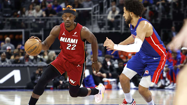 Dec 16, 2024; Detroit, Michigan, USA; Miami Heat forward Jimmy Butler (22) dribbles as Detroit Pistons guard Cade Cunningham (2) defends in the first half at Little Caesars Arena. Mandatory Credit: Rick Osentoski-Imagn Images Dec 16, 2024; Detroit, Michigan, USA; Miami Heat forward Jimmy Butler (22) dribbles as Detroit Pistons guard Cade Cunningham (2) defends in the first half at Little Caesars Arena. Mandatory Credit: Rick Osentoski-Imagn Images