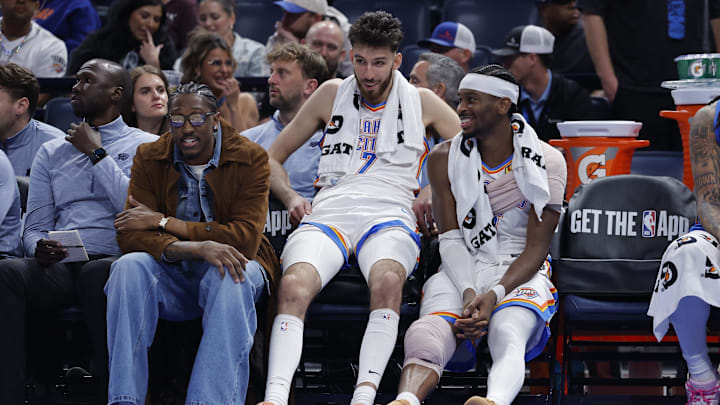 Nov 12, 2025; Oklahoma City, Oklahoma, USA; Oklahoma City Thunder guard Jalen Williams (8), center Chet Holmgren (7), and guard Shai Gilgeous-Alexander (2) talk while sitting on the bench during the fourth quarter against the Los Angeles Lakers at Paycom Center. Mandatory Credit: Alonzo Adams-Imagn Images Nov 12, 2025; Oklahoma City, Oklahoma, USA; Oklahoma City Thunder guard Jalen Williams (8), center Chet Holmgren (7), and guard Shai Gilgeous-Alexander (2) talk while sitting on the bench during the fourth quarter against the Los Angeles Lakers at Paycom Center. Mandatory Credit: Alonzo Adams-Imagn Images