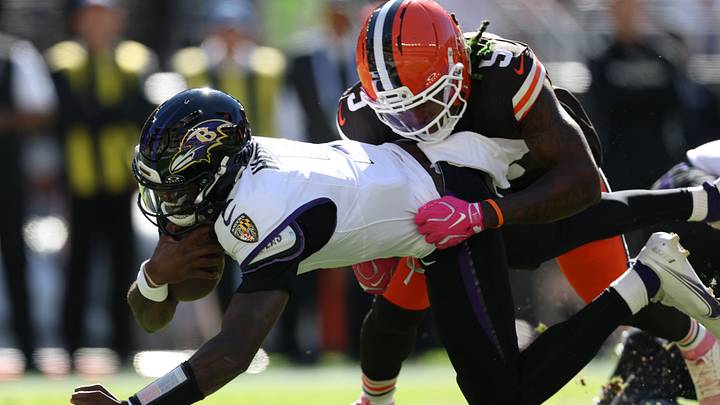 Oct 18, 2026; Cleveland, Ohio, USA;  Baltimore Ravens quarterback Tyler Huntley (5) runs the ball against Cleveland Browns linebacker Quincy Williams (5) in the first quarter at Huntington Bank Field.  Mandatory Credit: Scott Galvin-Imagn Images
