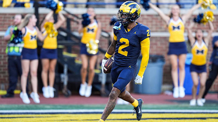 Michigan defensive back Will Johnson celebrates a touchdown after intercepting USC quarterback Miller Moss during the second half at Michigan Stadium in Ann Arbor on Saturday, Sept. 21, 2024.