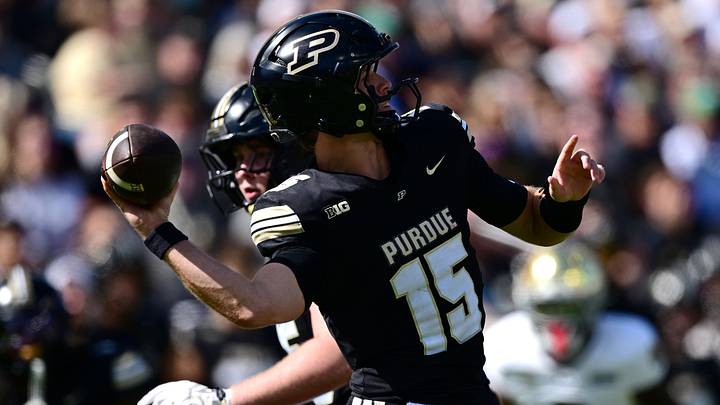 Purdue Boilermakers quarterback Ryan Browne (15) attempts a pass. Purdue Boilermakers quarterback Ryan Browne (15) attempts a pass.