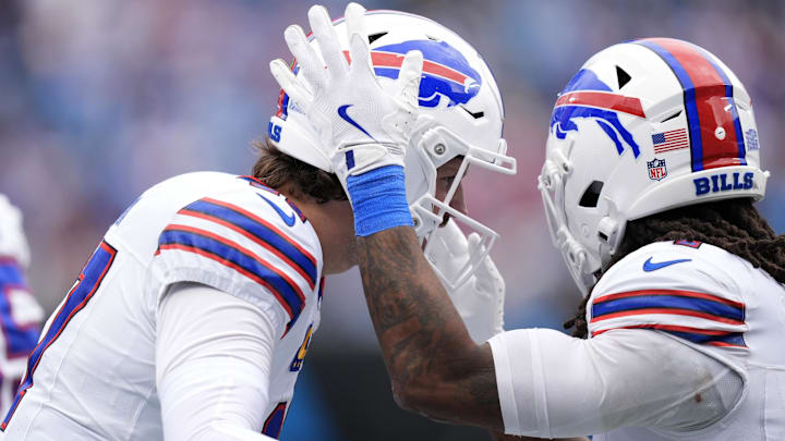 Buffalo Bills running back James Cook III celebrates with quarterback Josh Allen. Buffalo Bills running back James Cook III celebrates with quarterback Josh Allen.