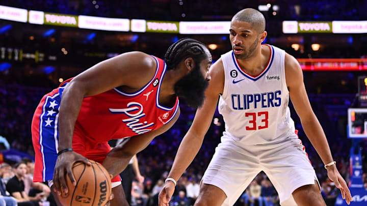 Dec 23, 2022; Philadelphia, Pennsylvania, USA; Los Angeles Clippers guard Nicolas Batum (33) defends Philadelphia 76ers guard James Harden (1) in the second quarter at Wells Fargo Center. Mandatory Credit: Kyle Ross-Imagn Images