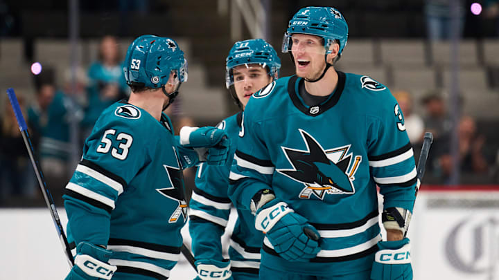 Sep 21, 2025; San Jose, California, USA; San Jose Sharks defenseman John Klingberg (3) celebrates with left wing Jeff Skinner (53) and forward Michael Misa (77) after scoring a power play goal against the Vegas Golden Knights during the second period at SAP Center at San Jose. Mandatory Credit: Robert Edwards-Imagn Images