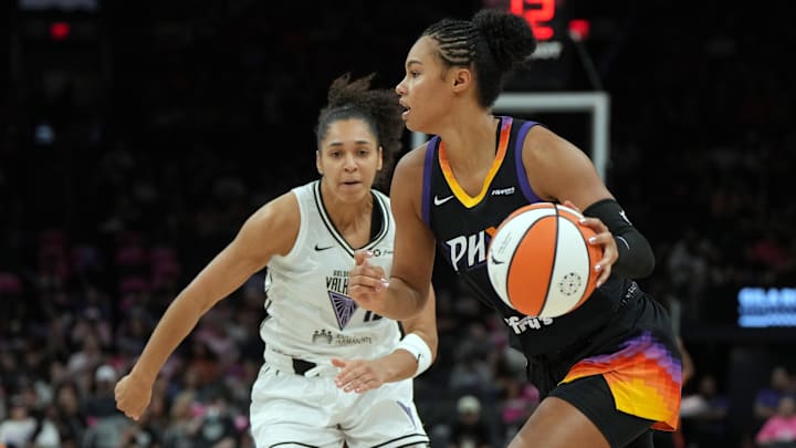 Aug 22, 2025; Phoenix, Arizona, USA; Phoenix Mercury forward Kathryn Westbeld (24) drives around Golden State Valkyries center Iliana Rupert (12) in the second half at Footprint Center. Mandatory Credit: Rick Scuteri-Imagn Images