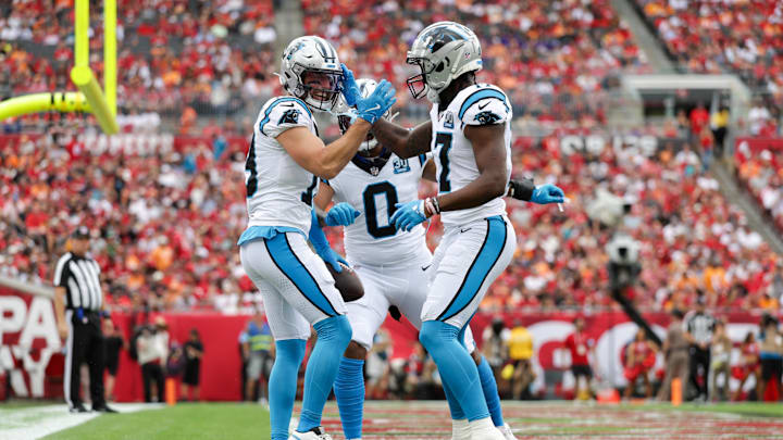 Dec 29, 2024; Tampa, Florida, USA; Carolina Panthers wide receiver Adam Thielen (19) celebrates with wide receiver Xavier Legette (17)after scoring a touchdown against the Tampa Bay Buccaneers in the first quarter at Raymond James Stadium. Mandatory Credit: Nathan Ray Seebeck-Imagn Images