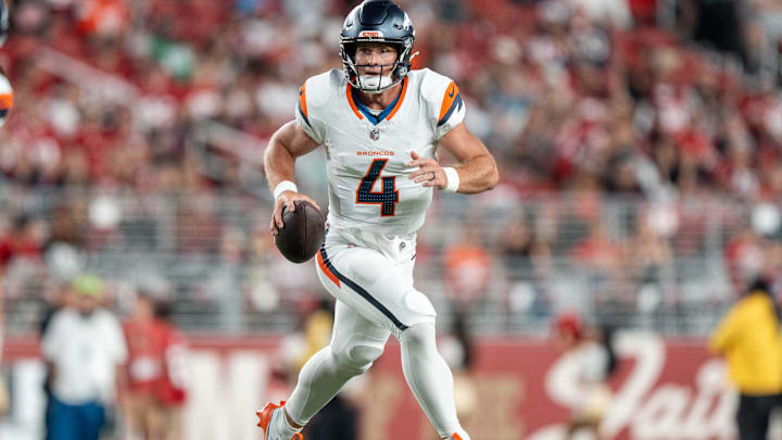 August 9, 2025; Santa Clara, California, USA; Denver Broncos quarterback Sam Ehlinger (4) runs against the San Francisco 49ers during the fourth quarter at Levi's Stadium. Mandatory Credit: Kyle Terada-Imagn Images