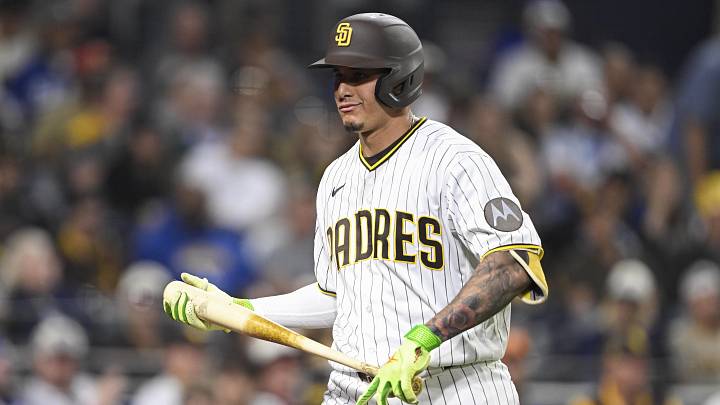May 20, 2026; San Diego, California, USA; San Diego Padres third baseman Manny Machado (13) walks back to the dugout after striking out during the ninth inning against the Los Angeles Dodgers at Petco Park. Mandatory Credit: Denis Poroy-Imagn Images