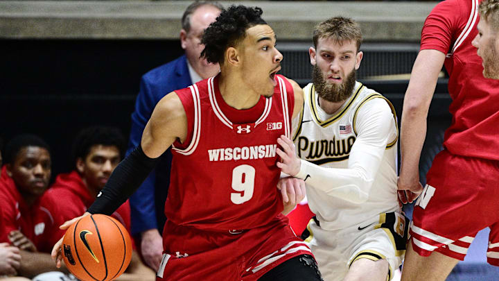 Wisconsin Badgers guard John Tonje (9) controls the ball as Purdue Boilermakers guard Braden Smith (3) defends Wisconsin Badgers guard John Tonje (9) controls the ball as Purdue Boilermakers guard Braden Smith (3) defends