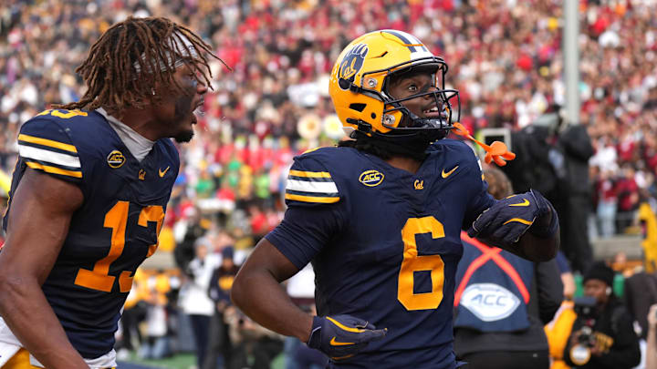 Jonathan Brady, right, celebrates scoring a touchdown with teammate Nyziah Hunter. Jonathan Brady, right, celebrates scoring a touchdown with teammate Nyziah Hunter.