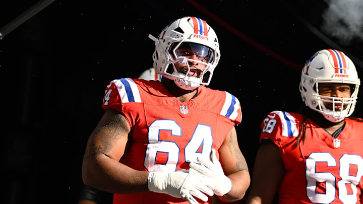 Dec 1, 2024; Foxborough, Massachusetts, USA; New England Patriots guard Layden Robinson (64) walks out of the player's tunnel before a game against the Indianapolis Colts at Gillette Stadium. Mandatory Credit: Eric Canha-Imagn Images