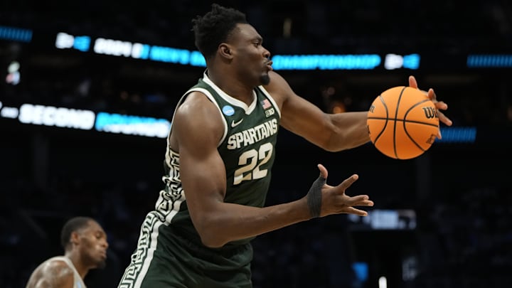March 21, 2024, Charlotte, NC, USA; Michigan State Spartans center Mady Sissoko (22) rebounds the ball against the Mississippi State Bulldogs in the first round of the 2024 NCAA Tournament at the Spectrum Center. Mandatory Credit: Bob Donnan-Imagn Images