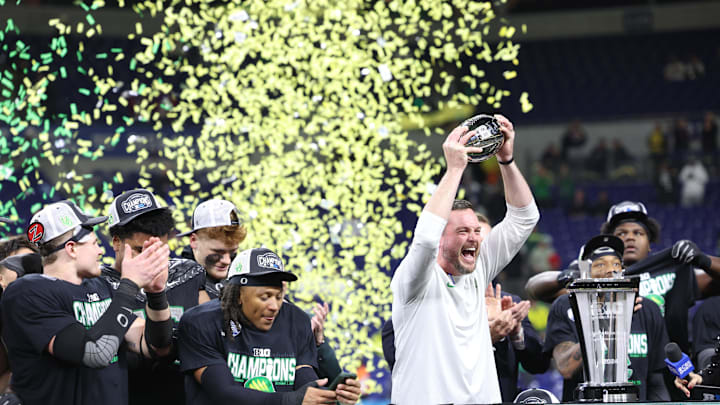 Dec 7, 2024; Indianapolis, IN, USA; Oregon Ducks head coach Dan Lanning and the Oregon Ducks celebrate defeating the Penn State Nittany Lions to win the Big Ten Championship in the 2024 Big Ten Championship game at Lucas Oil Stadium. Mandatory Credit: Jordan Prather-Imagn Images