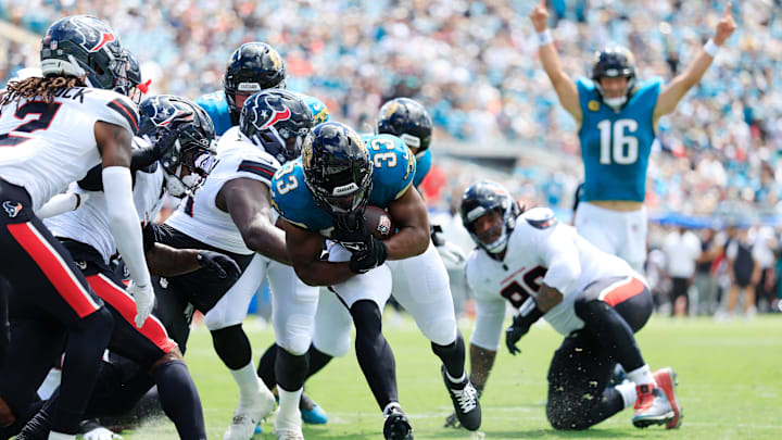 Jacksonville Jaguars running back Bhayshul Tuten (33) scores a rushing touchdown as quarterback Trevor Lawrence (16) celebrates during the first quarter of an NFL football matchup at EverBank Stadium, Sunday, Sept. 21, 2025, in Jacksonville, Fla. The Jaguars defeated the Texans 17-10. The Jaguars defeated the Texans 17-10.