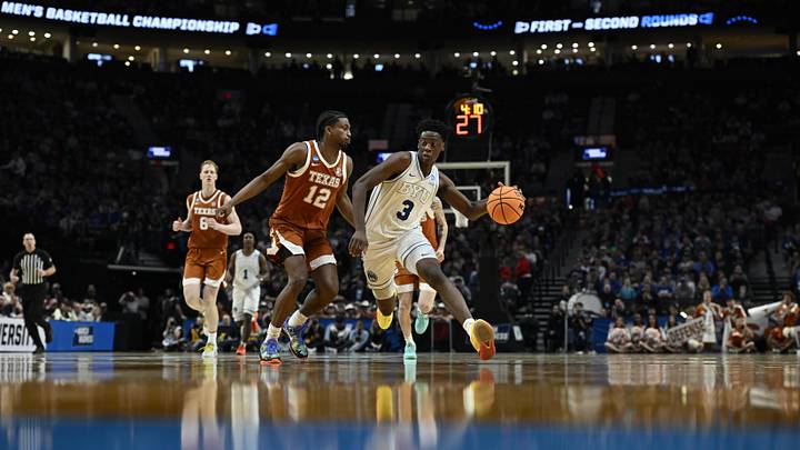 Mar 19, 2026; Portland, OR, USA; BYU Cougars forward AJ Dybantsa (3) drives against Texas Longhorns guard Tramon Mark (12) in the second half during a first round game of the men's 2026 NCAA Tournament at Moda Center. Mandatory Credit: Troy Wayrynen-Imagn Images