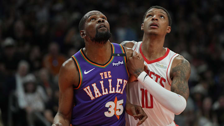 Mar 30, 2025; Phoenix, Arizona, USA; Phoenix Suns forward Kevin Durant (35) and Houston Rockets forward Jabari Smith Jr. (10) fight for position in the first half at Footprint Center. Mandatory Credit: Rick Scuteri-Imagn Images