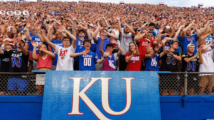 Aug 29, 2025; Lawrence, Kansas, USA; Kansas Jayhawks student fans celebrate a touch down during the first half against the Wagner Seahawks  at David Booth Kansas Memorial Stadium. Mandatory Credit: William Purnell-Imagn Images