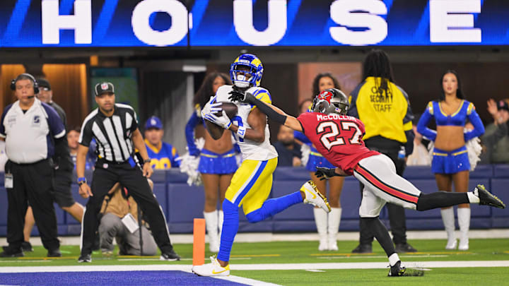 Nov 23, 2025; Inglewood, California, USA; Los Angeles Rams wide receiver Davante Adams (17) catches a twenty-four touchdown pass thrown by quarterback Matthew Stafford (not pictured) against Tampa Bay Buccaneers cornerback Zyon McCollum (27) during the second quarter at SoFi Stadium.  Mandatory Credit: Jayne Kamin-Oncea-Imagn Images