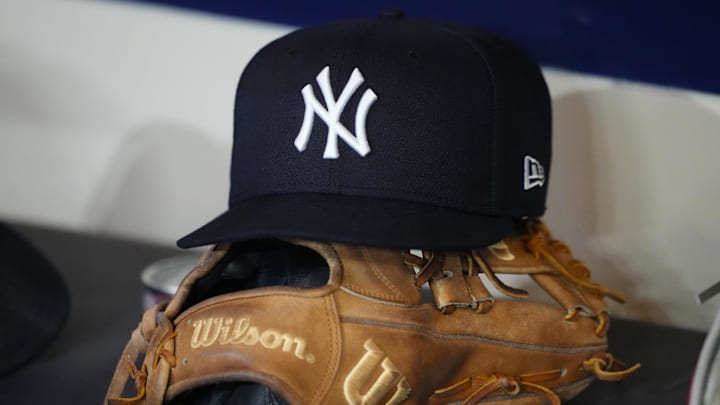 May 8, 2026; Milwaukee, Wisconsin, USA;  General view of a New York Yankees hat and glove prior to the game against the Milwaukee Brewers at American Family Field. Mandatory Credit: Jeff Hanisch-Imagn Images