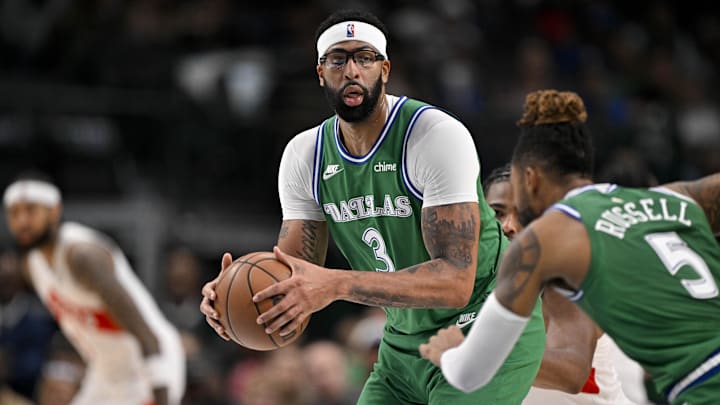 Oct 26, 2025; Dallas, Texas, USA; Dallas Mavericks forward Anthony Davis (3) looks to hand the ball off to guard D'Angelo Russell (5) during the second quarter against the Toronto Raptors at the American Airlines Center. Mandatory Credit: Jerome Miron-Imagn Images