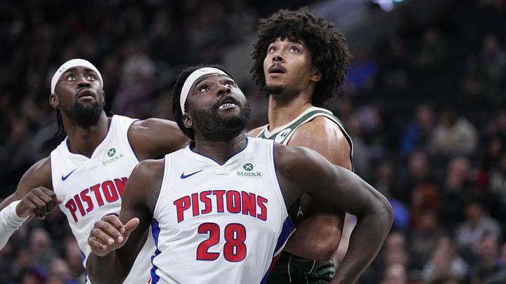 Dec 3, 2025; Milwaukee, Wisconsin, USA; Detroit Pistons forward Isaiah Stewart (28) and Milwaukee Bucks center Jericho Sims (00) box out for a free throw attempt in the first half at Fiserv Forum. Mandatory Credit: Michael McLoone-Imagn Images