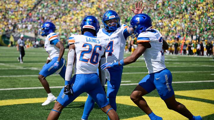 Boise State running back Sire Gaines (26) celebrates with quarterback Maddux Madsen (4) and wide receiver Cam Bates. Boise State running back Sire Gaines (26) celebrates with quarterback Maddux Madsen (4) and wide receiver Cam Bates.