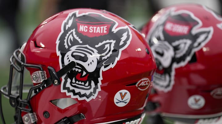Dec 30, 2022; Charlotte, NC, USA; North Carolina State Wolfpack helmets during the first half against the Maryland Terrapins in the 2022 Duke's Mayo Bowl at Bank of America Stadium. Mandatory Credit: Jim Dedmon-Imagn Images Dec 30, 2022; Charlotte, NC, USA; North Carolina State Wolfpack helmets during the first half against the Maryland Terrapins in the 2022 Duke's Mayo Bowl at Bank of America Stadium. Mandatory Credit: Jim Dedmon-Imagn Images