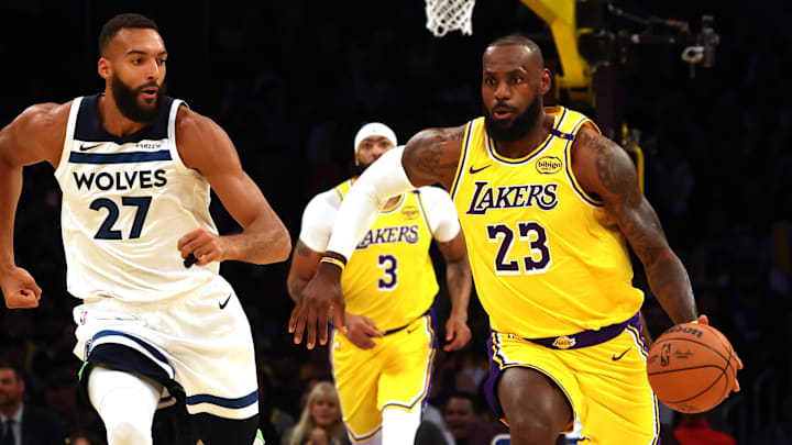 Los Angeles Lakers forward LeBron James dribbles against Minnesota Timberwolves center Rudy Gobert (27) during the first quarter at Crypto.com Arena in Los Angeles on Oct. 22, 2024. 