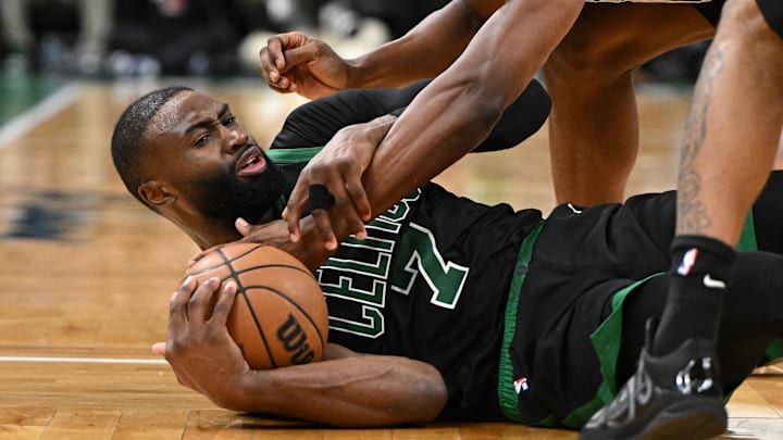 Boston Celtics guard Jaylen Brown and San Antonio Spurs forward Harrison Barnes battle for the ball.