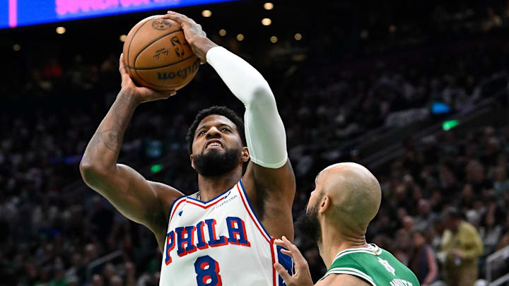 Dec 25, 2024; Boston, Massachusetts, USA; Philadelphia 76ers forward Paul George (8) shoots the ball against Boston Celtics guard Derrick White (9) during the first half at TD Garden. Mandatory Credit: Eric Canha-Imagn Images