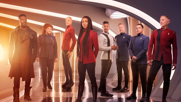 L-R David Ajala as Book, Mary Wiseman as Tilly, Doug Jones as Saru, Sonequa Martin-Green as Burnham, Wilson Cruz as Culber, Blu Del Barrio as Adira and Callum Keith Rennie as Raynor in season 5 of the Paramount+ original series STAR TREK: DISCOVERY. Photo Credit: James Dimmock/Paramount+