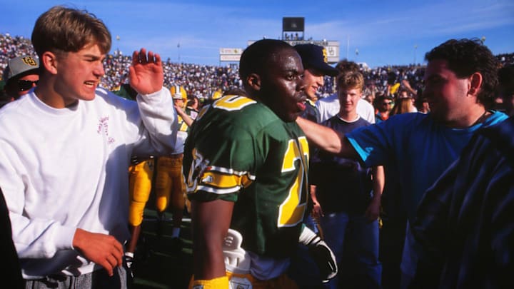 Fans congratulate Kenny Wheaton after his pick clinched a win over Washington at Autzen Stadium in 1994.