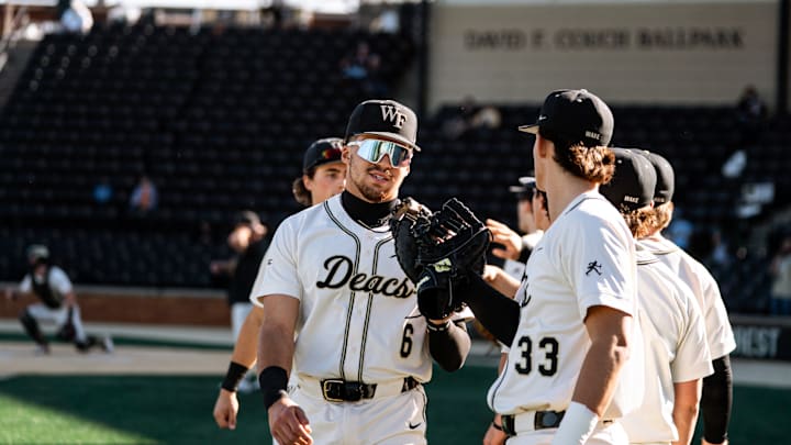 Wake Forest 1st baseman Kade Lewis with teammates prior to game against Siena 