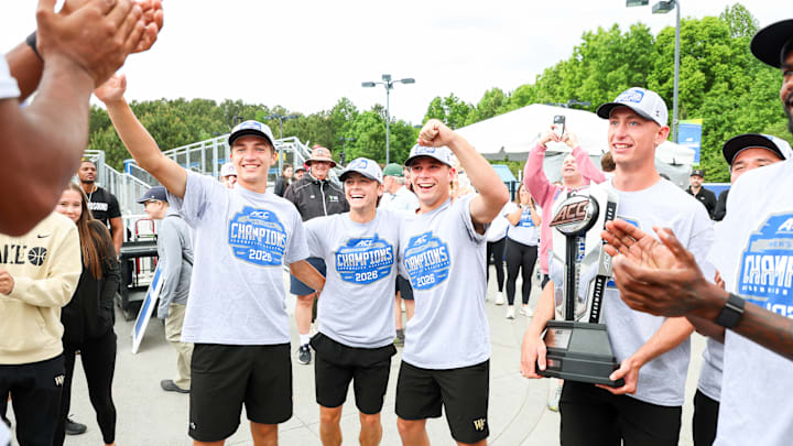 The Wake Forest men's tennis team celebrates after winning ACC Tournament Title 