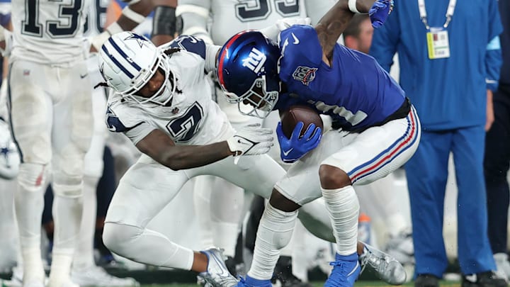 Sep 26, 2024; East Rutherford, New Jersey, USA; Dallas Cowboys cornerback Trevon Diggs tackles New York Giants wide receiver Malik Nabers during the third quarter at MetLife Stadium. Sep 26, 2024; East Rutherford, New Jersey, USA; Dallas Cowboys cornerback Trevon Diggs tackles New York Giants wide receiver Malik Nabers during the third quarter at MetLife Stadium.