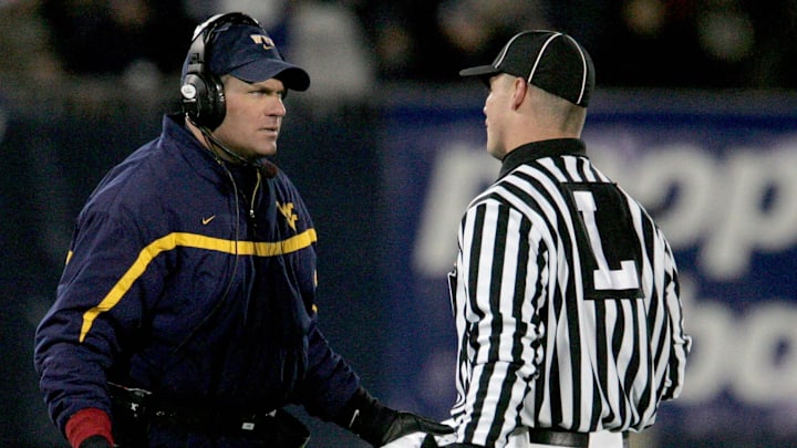 Oct 20, 2006; East Hartford, CT, USA; West Virginia Mountaineers head coach Rich Rodriguez questions the linesman in the 1st quarter against the Connecticut Huskies at Rentschler Field. Mandatory Credit: David Butler II-Imagn Images Copyright © David Butler II