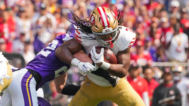 Sep 15, 2024; Minneapolis, Minnesota, USA; San Francisco 49ers running back Jordan Mason (24) runs with the ball against the Minnesota Vikings in the second quarter at U.S. Bank Stadium. Mandatory Credit: Brad Rempel-Imagn Images