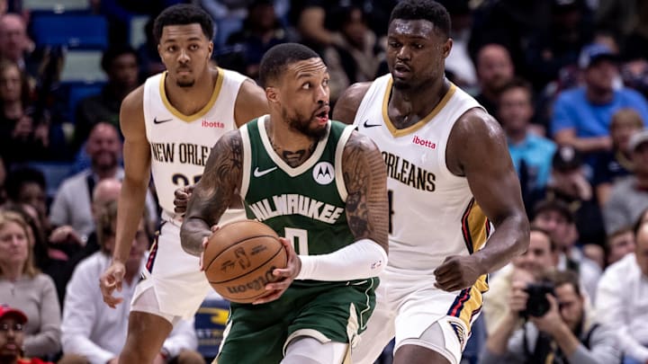 Mar 28, 2024; New Orleans, Louisiana, USA; Milwaukee Bucks guard Damian Lillard (0) looks to pass the ball against New Orleans Pelicans forward Zion Williamson (1) and guard Trey Murphy III (25) during the second half at Smoothie King Center. Mandatory Credit: Stephen Lew-Imagn Images Mar 28, 2024; New Orleans, Louisiana, USA; Milwaukee Bucks guard Damian Lillard (0) looks to pass the ball against New Orleans Pelicans forward Zion Williamson (1) and guard Trey Murphy III (25) during the second half at Smoothie King Center. Mandatory Credit: Stephen Lew-Imagn Images