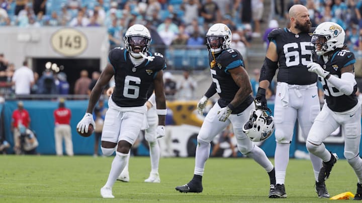 Nov 10, 2024; Jacksonville, Florida, USA; Jacksonville Jaguars safety Darnell Savage (6) celebrates an interception with safety Antonio Johnson (26) against the Minnesota Vikings during the third quarter at EverBank Stadium. Mandatory Credit: Morgan Tencza-Imagn Images
