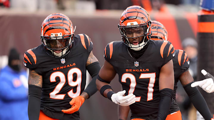 Dec 22, 2024; Cincinnati, Ohio, USA; Cincinnati Bengals safety Jordan Battle (27) celebrates an interception with cornerback Cam Taylor-Britt (29) during the fourth quarter against the Cleveland Browns at Paycor Stadium. Mandatory Credit: Joseph Maiorana-Imagn Images Dec 22, 2024; Cincinnati, Ohio, USA; Cincinnati Bengals safety Jordan Battle (27) celebrates an interception with cornerback Cam Taylor-Britt (29) during the fourth quarter against the Cleveland Browns at Paycor Stadium. Mandatory Credit: Joseph Maiorana-Imagn Images