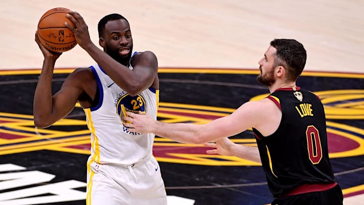 Jun 8, 2018; Cleveland, OH, USA; Golden State Warriors forward Draymond Green (23) handles the ball against Cleveland Cavaliers center Kevin Love (0) during the third quarter in game four of the 2018 NBA Finals at Quicken Loans Arena. Mandatory Credit: Kyle Terada-Imagn Images