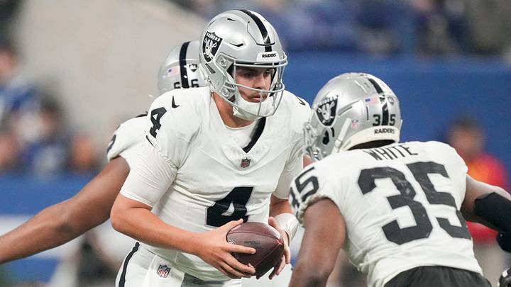 Las Vegas Raiders quarterback Aidan O'Connell (4) turns to hand the ball to Las Vegas Raiders running back Zamir White (35) on Sunday, Dec. 31, 2023, during a game against the Las Vegas Raiders at Lucas Oil Stadium in Indianapolis. Las Vegas Raiders quarterback Aidan O'Connell (4) turns to hand the ball to Las Vegas Raiders running back Zamir White (35) on Sunday, Dec. 31, 2023, during a game against the Las Vegas Raiders at Lucas Oil Stadium in Indianapolis.