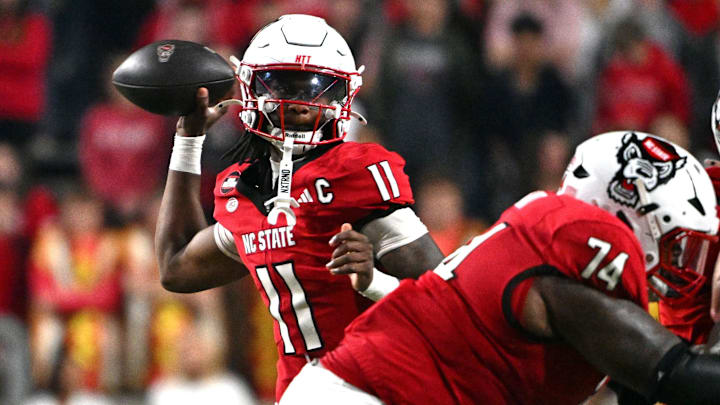 Nov 1, 2025; Raleigh, North Carolina, USA; North Carolina State Wolfpack quarter back CJ Bailey (11) throws a pass during the first quarter against the Georgia Tech Yellow Jackets at Carter-Finley Stadium. Mandatory Credit: Zachary Taft-Imagn Images Nov 1, 2025; Raleigh, North Carolina, USA; North Carolina State Wolfpack quarter back CJ Bailey (11) throws a pass during the first quarter against the Georgia Tech Yellow Jackets at Carter-Finley Stadium. Mandatory Credit: Zachary Taft-Imagn Images