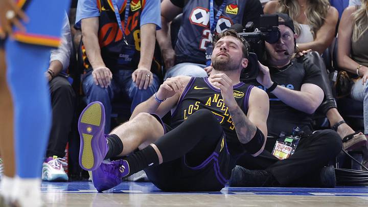 Apr 2, 2026; Oklahoma City, Oklahoma, USA; Los Angeles Lakers guard Luka Doncic (77) falls to the court during a play against the Oklahoma City Thunder during the third quarter at Paycom Center. Mandatory Credit: Alonzo Adams-Imagn Images